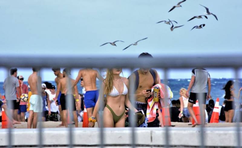 Cover up: Tourists in Spain warned of fines for going topless