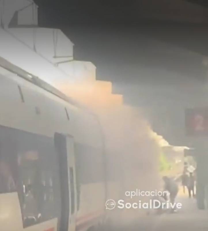 <span style='color:#780948'>ARCHIVED</span> - Packed Madrid train bursts into flames minutes into journey