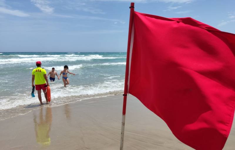 Red flags flying at Mediterranean beaches in La Manga del Mar Menor