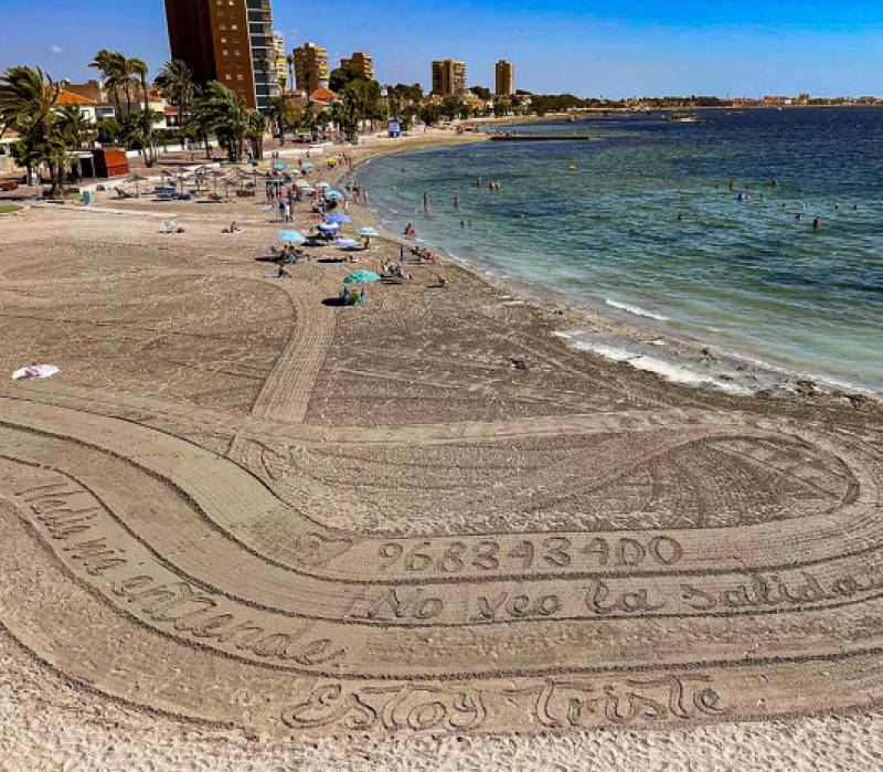 Distress messages appear in the sand on San Javier beach