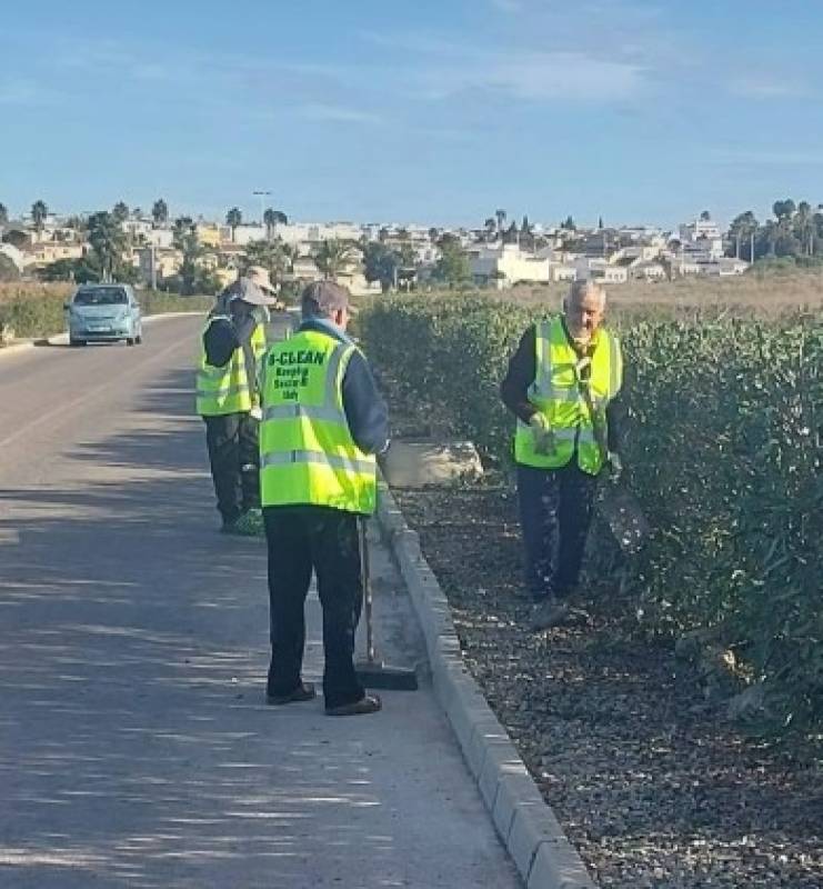 B Clean gardening volunteers trimming hedges and planning ahead for 2026