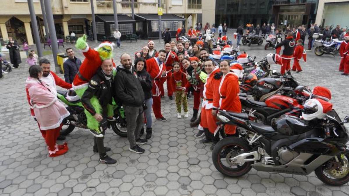 Revving up for Christmas! Santas on bikes help those in need